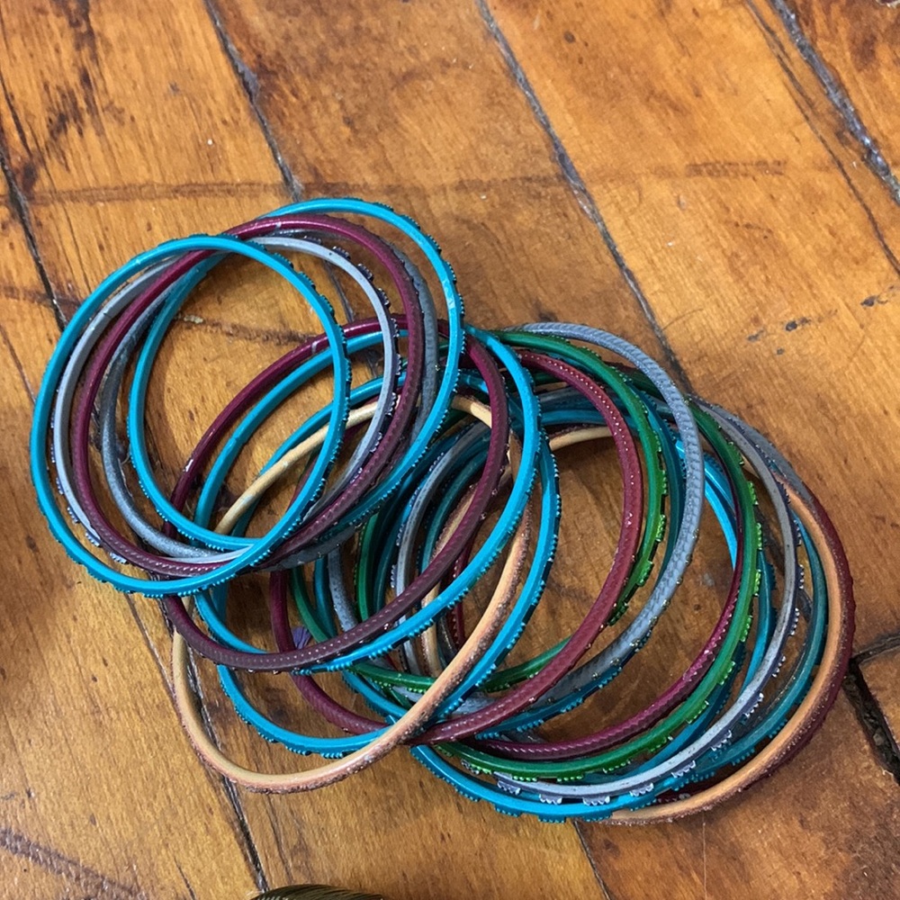 Stack of 20+ colorful bracelets